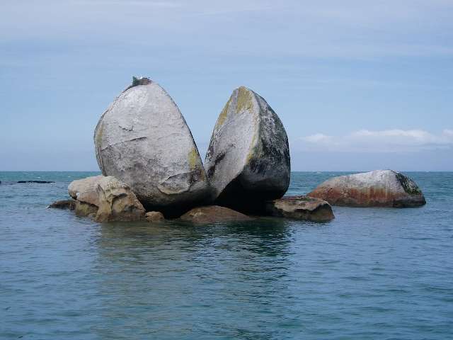 Photo of a large rock that is split in two. The shared vision of the map of Bounded Contexts lets all developers nudge the code in this direction whenever they have the occasion.