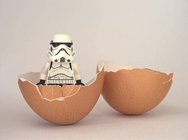 Photo of a Lego Star Wars Stormtrooper emerging from an egg shell. Emergent architecture is another wide-spread strategy. In practice, it often looks like 'we'll do the architecture later'.