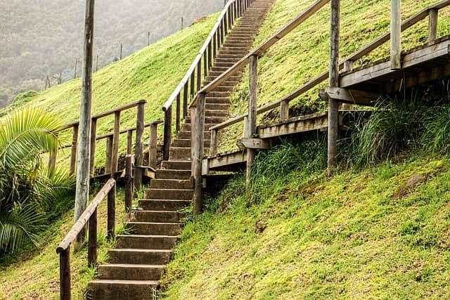 Photo of crossroads of wooden walking path. If you get to that point in the Big Picture Event Storming, don't miss on the occasion of doing this tremendous value activity!