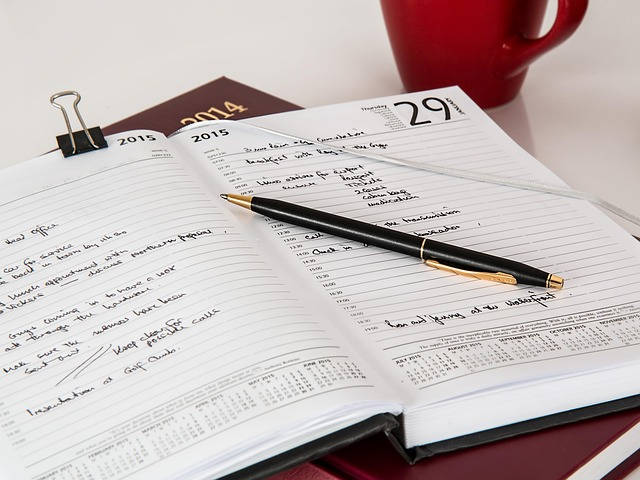 Photo of an agenda with daily notes. Keeping track of what happens during every Event Storming chunk is a cheap benefit of running sessions remotely.
