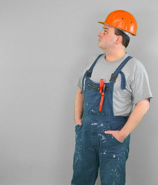 Photo of a construction worker taking a step back to review the work done. The end of every Event Storming session is the occasion to take a look at the raised problems, questions, and decisions.