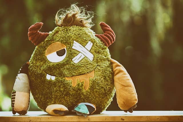 A scruffy green plush monster with horns and a plaster over one eye. Give your workflow's problematic patterns a funny name, and everyone will recognize them.